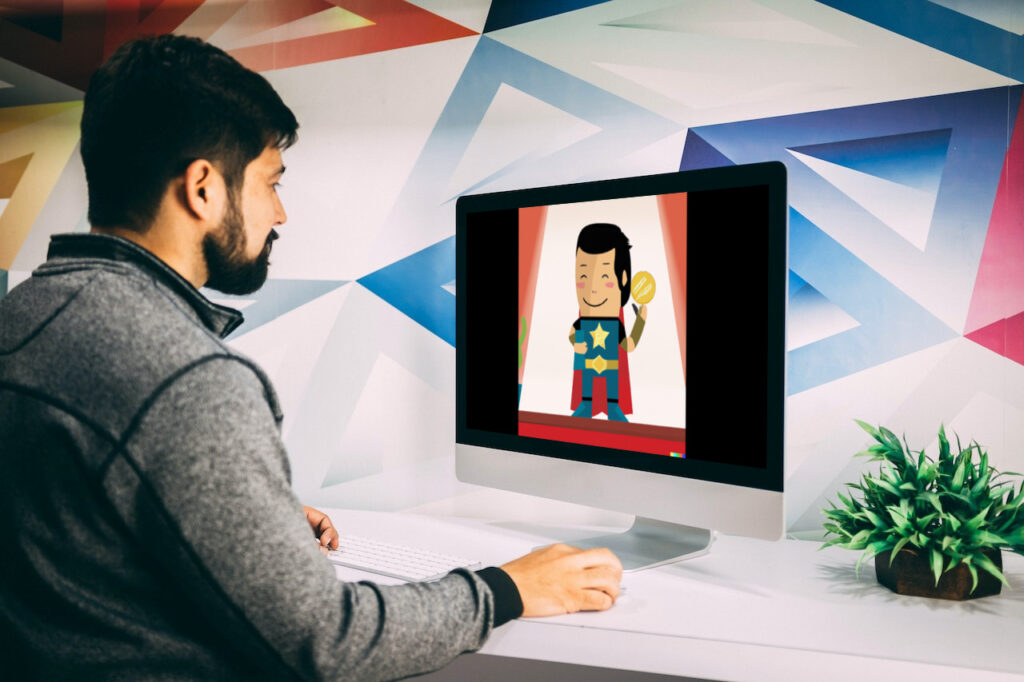 Man reviews the results of his successful campaign based on good brand strategy, superhero accepting a medal on iMac screen