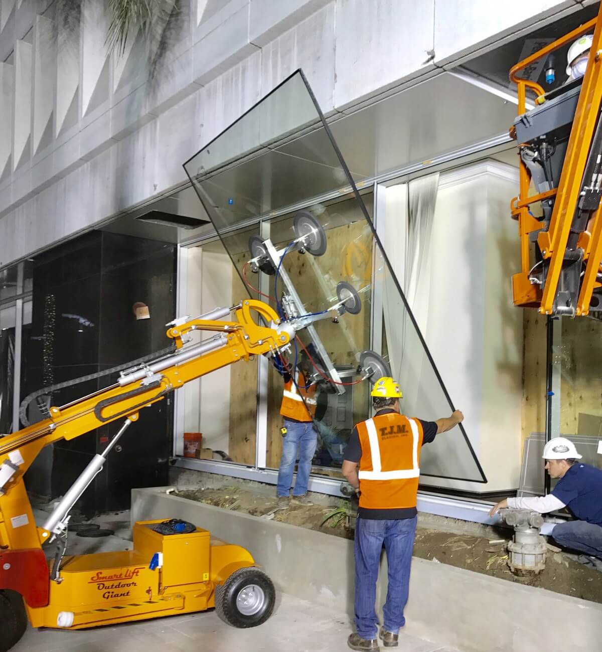 The TJM crew install a giant glass pane into the curtain wall installation of 9401 Wilshire. Branding isn't just a logo on a shirt, it's how people feel when they see the crew show up wearing that shirt.