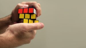 Rubiks cube in man's hands